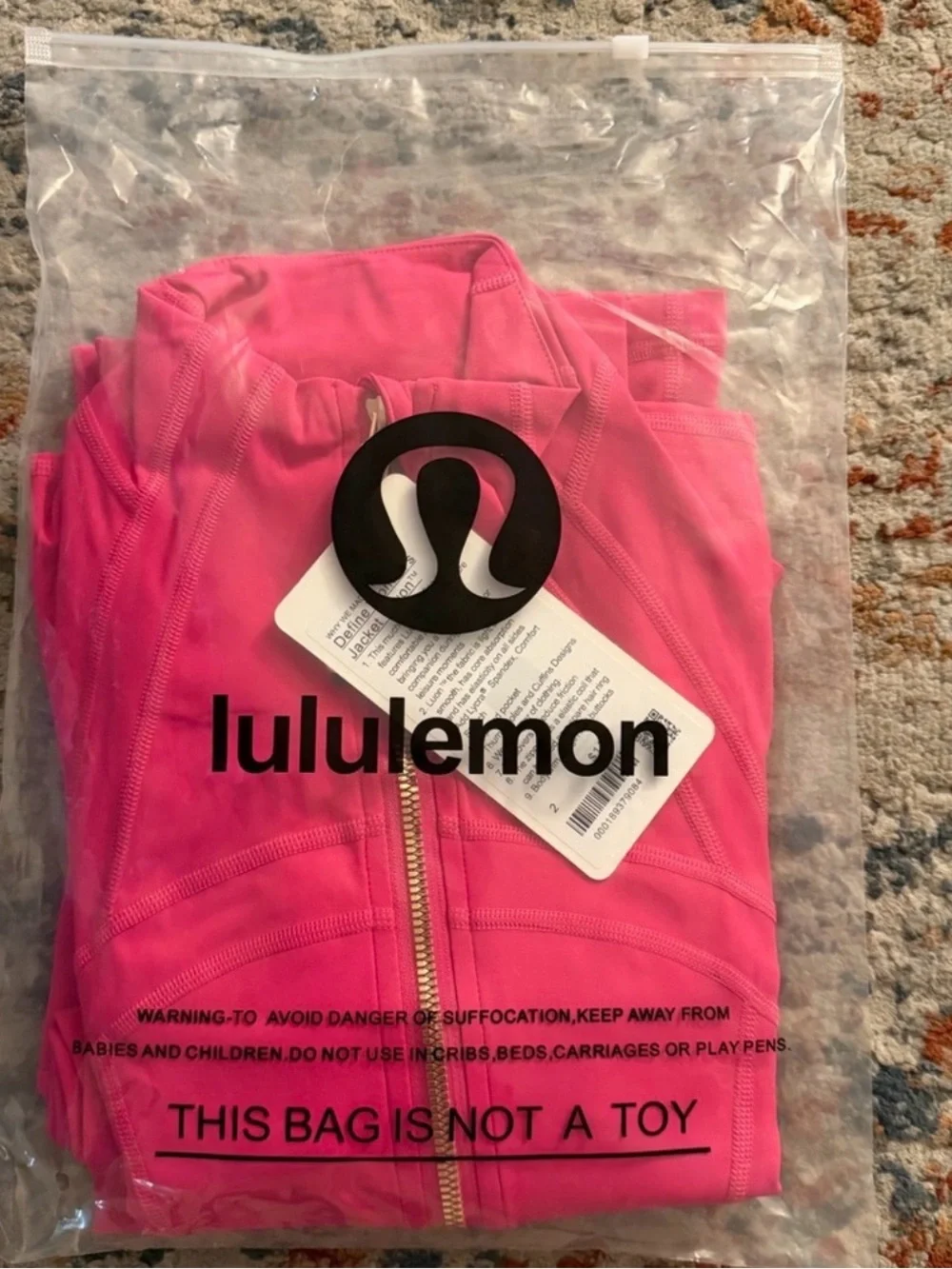 lululemon bright pink jacket with gold zipper